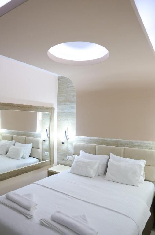 Bright double room with fresh white linen