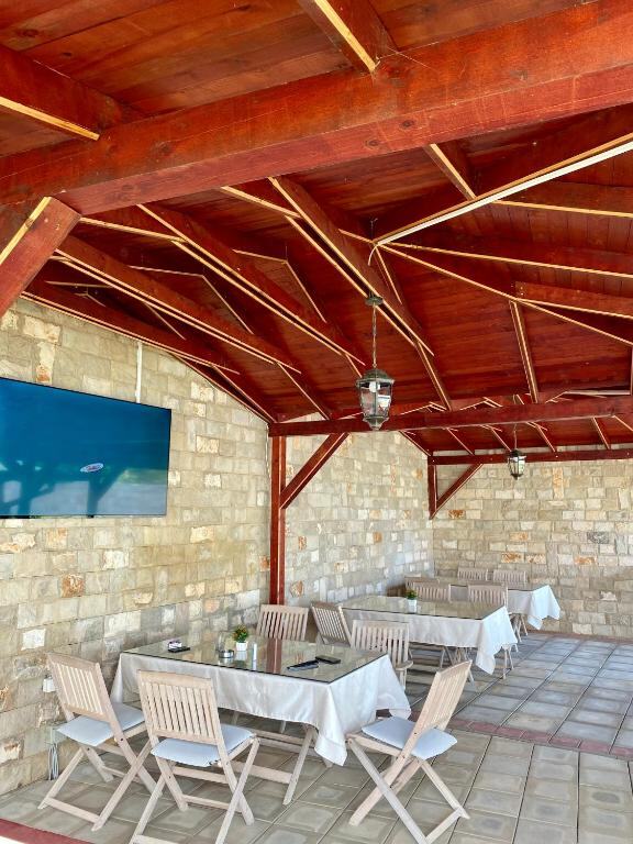 Breakfast terrace with stone walls and wooden beams